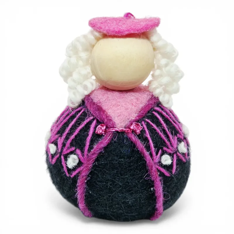 Handmade wool Girl Flóki with curly hair, elegant light pink sweater with knot decor. Icelandic souvenir and gift