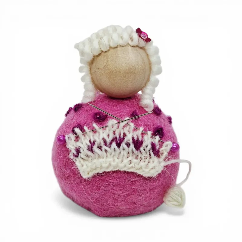 Handmade light pink wool Knitting Lady Flóki knitting a sweater. Icelandic souvenir and gift