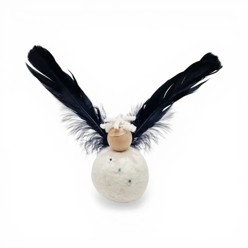 Large angel handmade from wool with black feathered wings, halo, and flowers. Icelandic souvenir and gift