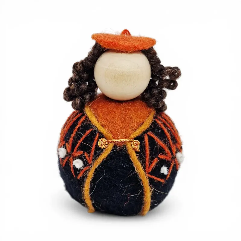Handmade wool Girl Flóki with curly hair, elegant orange sweater with knot decor. Icelandic souvenir and gift