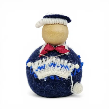 Handmade blue wool Knitting Man Flóki with red bow knitting a sweater. Icelandic souvenir and gift.
