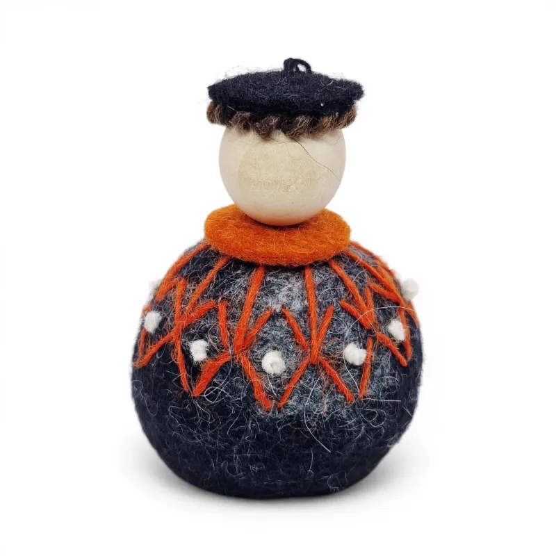 Handmade Shepherd Flóki in a patterned orange Icelandic wool sweater and a hat. Icelandic souvenir and gift