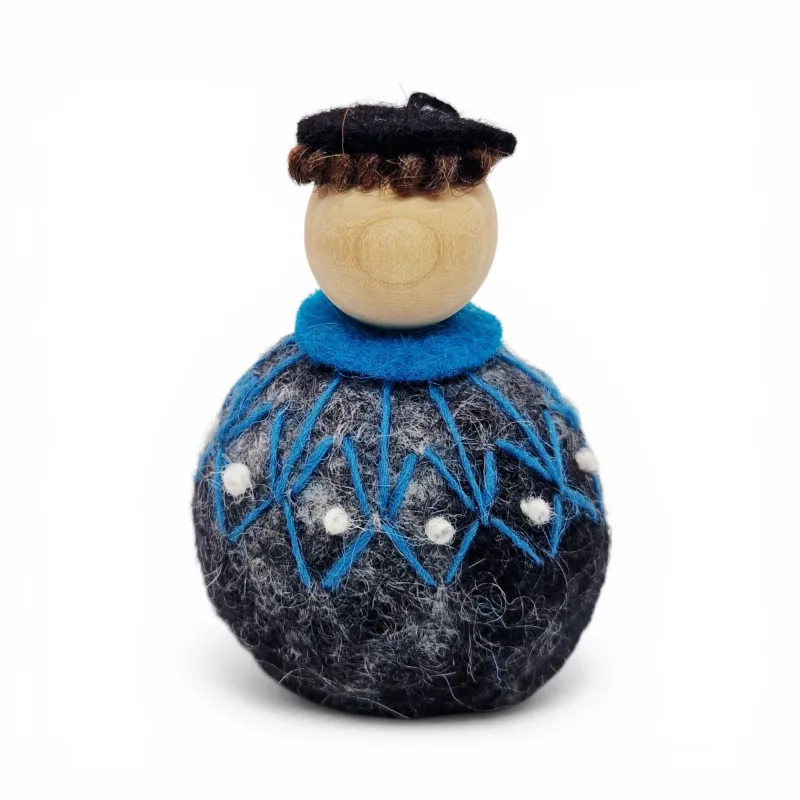 Handmade Shepherd Flóki in a patterned turquoise Icelandic wool sweater and a hat. Icelandic souvenir and gift