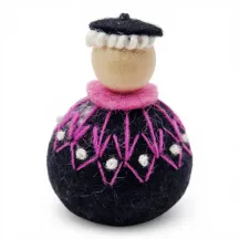 Handmade Shepherd Flóki in a patterned light pink Icelandic wool sweater and a hat. Icelandic souvenir and gift