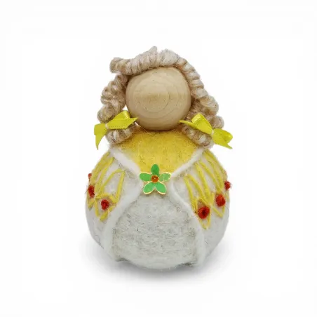 Handmade wool Summer Girl Flóki wearing yellow wool sweater with matching hair bow. Icelandic souvenir and gift