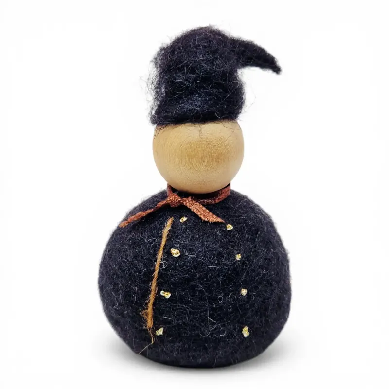 Handmade wool Icelandic Man Flóki wearing a traditional tail hat and brown neck scarf. Icelandic souvenir & gift
