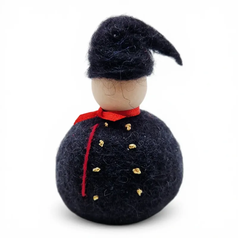 Handmade wool Icelandic Man Flóki wearing a traditional tail hat and red neck scarf. Icelandic souvenir & gift