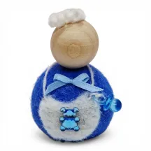 Handmade blue wool boy Flóki child wearing bib apron with teddy bear. Icelandic souvenir and gift.