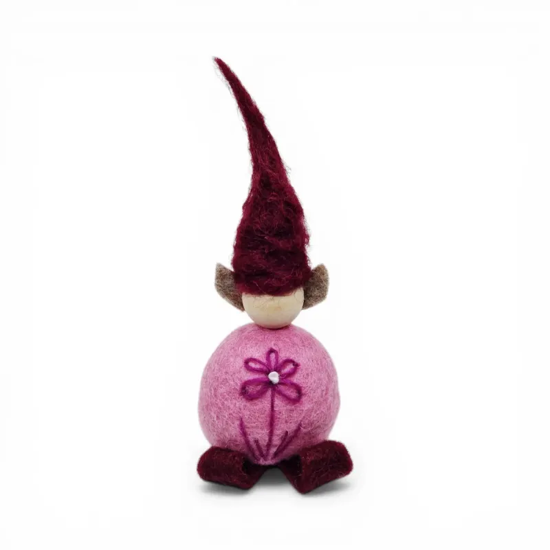 Handmade pink wool Flower Elf Flóki with a burgundy hat and a decorative flower. Icelandic souvenir and gift