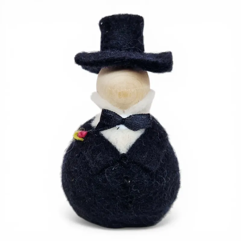 Handmade wool Bridegroom Flóki in a black suit, top hat, black bow, and pink boutonniere. Icelandic souvenir and gift