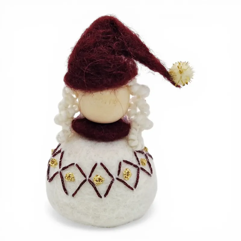 Handmade wool Santa Girl Flóki with a burgundy tasselled hat and matching diamond wool sweater. Icelandic folk art and gift