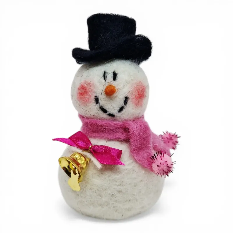 Handmade wool Snowman Flóki with rosy cheeks, light pink scarf & bow, and golden bell. Icelandic souvenir and gift.