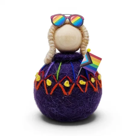 Handmade purple wool Rainbow Girl Flóki, in a decorated sweater with the progress flag. Icelandic Pride souvenir and gift